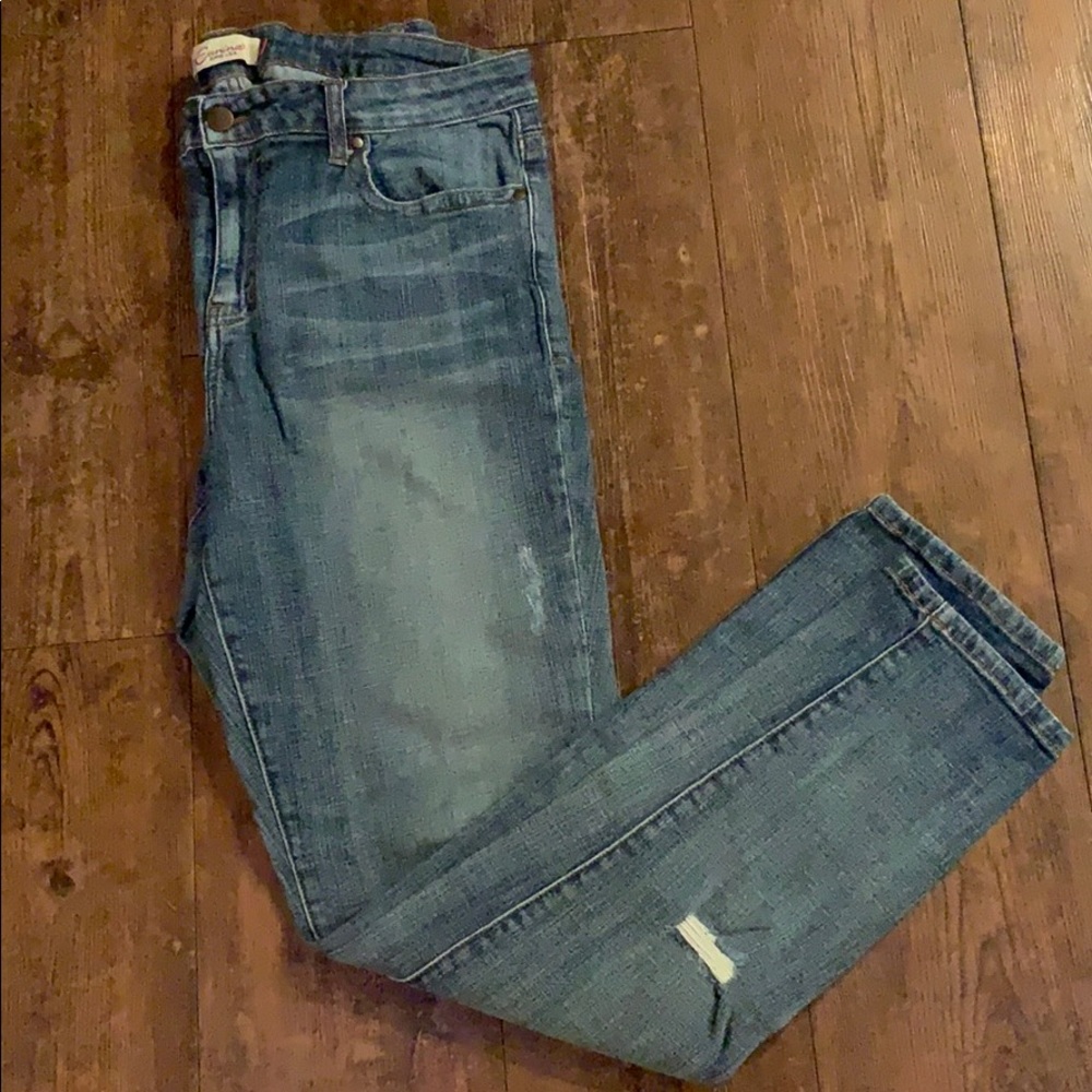 Light blue jeans that have the “worn” look